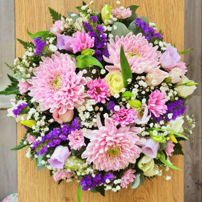 Posy SYM-345 - A classic funeral posy arranged with love using purple, pink, and white flowers.
