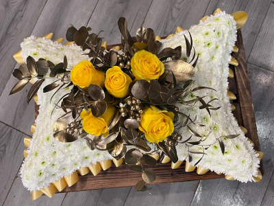 Golden Pillow Tribute - An elegant funeral pillow tribute in classic white with vibrant yellow and gold detailing, handcrafted by Daisy Chain Florist in Scunthorpe.