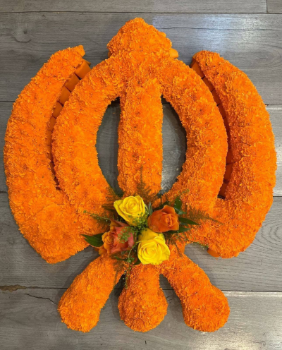 sikh - When accompanying a Khanda floral tribute. It signifies sincerity and respect and reflects Sikh teachings on the cycle of life, divine will, and eternal peace.