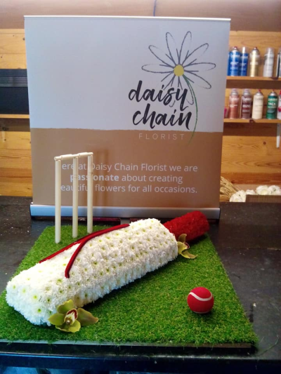 Cricket Bat Funeral Tribute - Cricket Bat funeral tribute: a fun way to honor a friend or loved one. The bag measures 1ft long and sits on a base at least 1.5 ft wide.