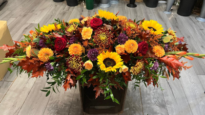 Golden Harvest Coffin Spray - The Golden Harvest coffin spray expresses a heartfelt farewell, beautifully handcrafted by Daisy Chain. The blend of rich, warm seasonal tones, featuring a harmonious mix of deep o