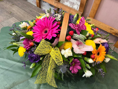 Hello basket arrangement - This classic basket overflows with vibrant, bold colors featuring a mixed selection of seasonal flowers.
Each arrangement is handcrafted by one of our talented florists at Daisy Ch